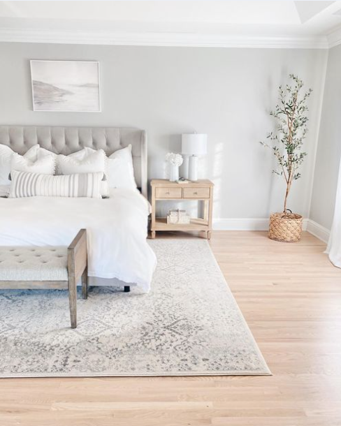 Cool grey bedroom showcasing an ivory floral ornamental rug